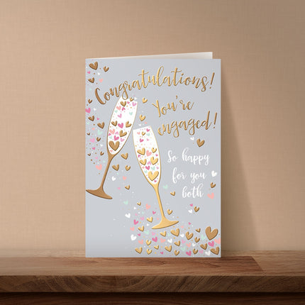 Engagement Card – Champagne Toast & Hearts Design with Gold Foil