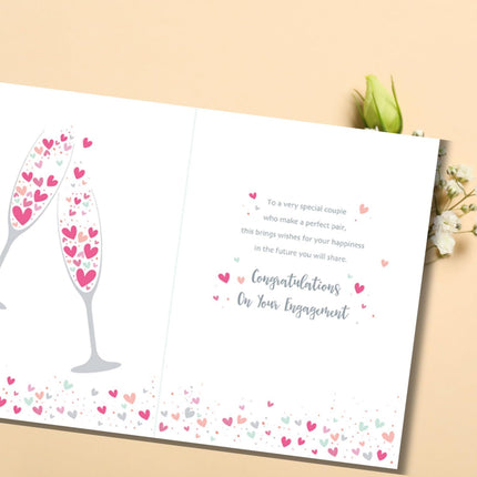 Engagement Card – Champagne Toast & Hearts Design with Gold Foil